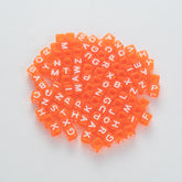 BD00078-02-white-letter-bright-orange-transparent-cube-alphabet-beads-mix-6mm